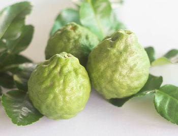 Close-up of green fruits on table