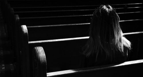 Rear view of woman walking on staircase