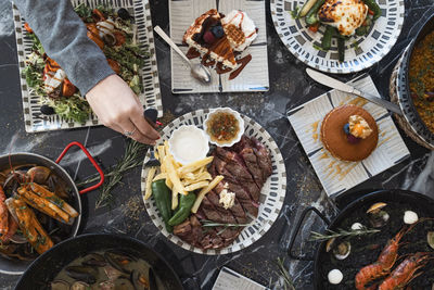 Top view of restaurant table with menu of tasty dishes. restaurant menu concept.