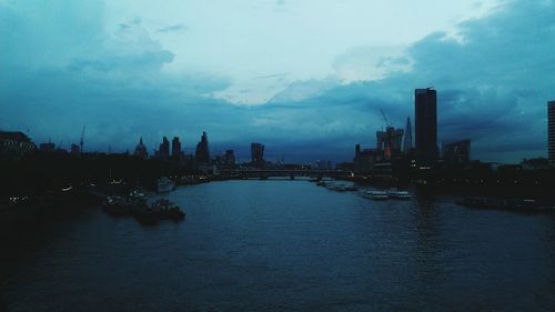 Cityscape against cloudy sky