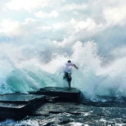 Two people surfing in sea