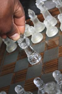 High angle view of man preparing chess