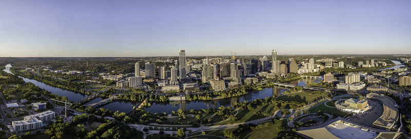 High angle view of city buildings against clear sky