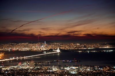 High angle view of illuminated buildings in city at night