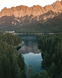 Scenic view of lake and mountains against sky