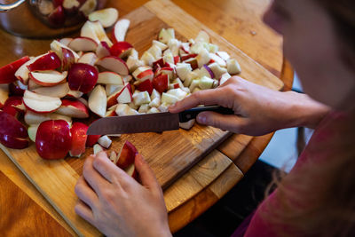 High angle view of person preparing food on cutting board