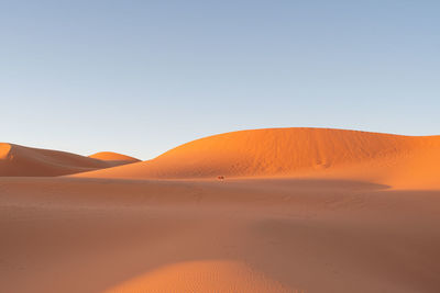 Scenic view of desert against clear sky