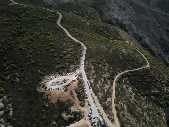 High angle view of road amidst trees and plants