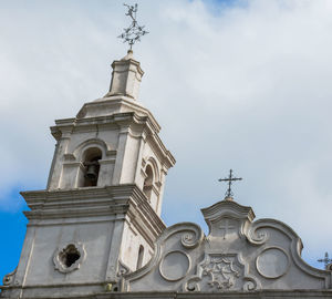 Low angle view of clock tower against sky