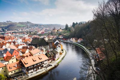 High angle view of river amidst buildings in town