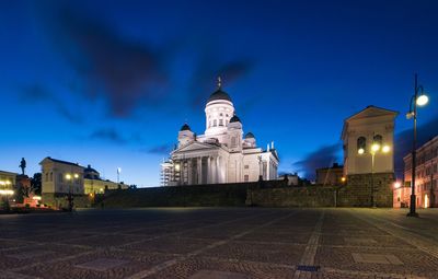 View of illuminated cathedral against blue sky