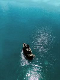 High angle view of people on boat in sea