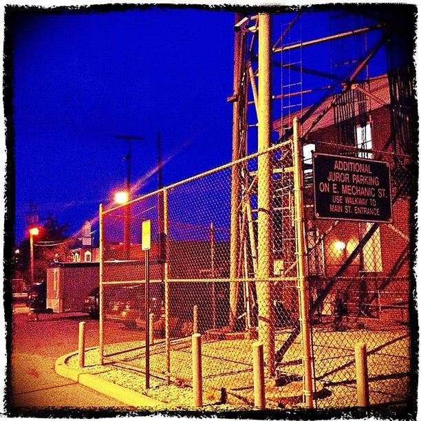 illuminated, built structure, architecture, building exterior, transfer print, night, blue, auto post production filter, metal, clear sky, sky, railroad track, communication, outdoors, no people, city, lighting equipment, railing, fence, light - natural phenomenon