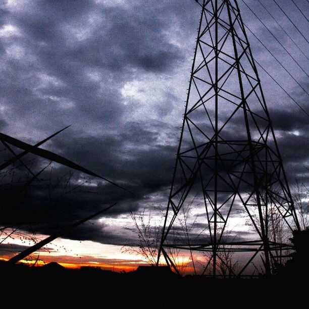 sky, cloud - sky, low angle view, cloudy, silhouette, electricity pylon, built structure, connection, sunset, weather, architecture, cloud, power line, dusk, power supply, overcast, fuel and power generation, electricity, nature, dramatic sky