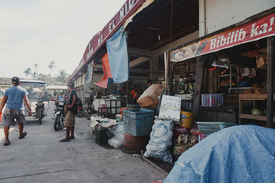 People at market stall in city