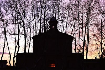 Low angle view of bare tree against sky