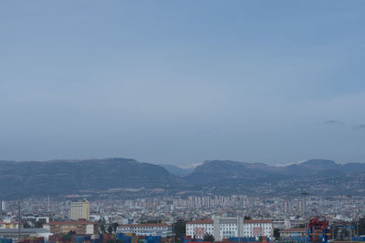 High angle view of buildings in city against clear sky