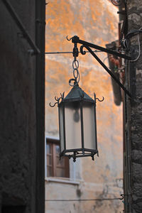 Low angle view of street light against building