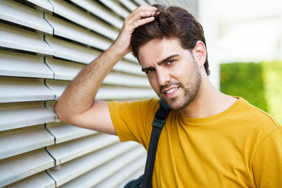 Portrait of young man standing outdoors