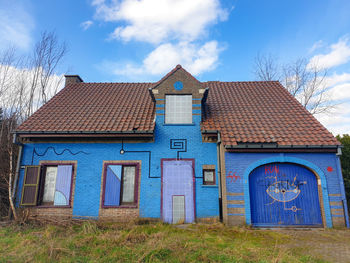 House on field against sky