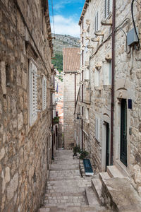 Narrow alley amidst buildings in town