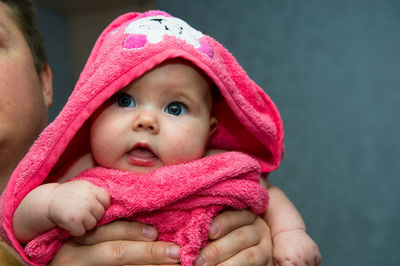 Close-up portrait of smiling young woman in warm clothing