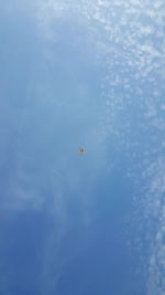 Low angle view of airplane flying in sky