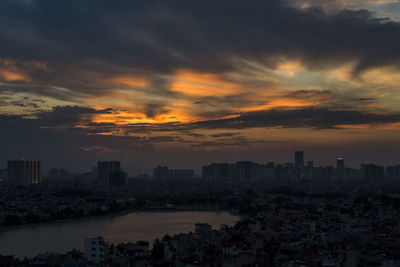 High angle view of buildings against sky at sunset