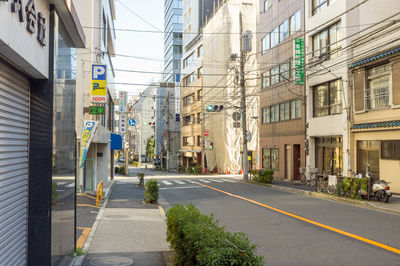 Road amidst buildings in city