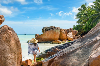 Young woman on sandy beach, tropical, exotic, travel, vacation, summer.