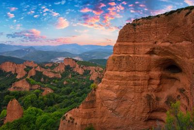 Scenic view of mountain against cloudy sky