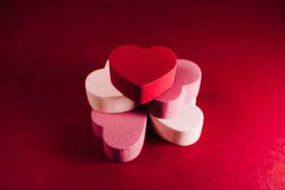 Close-up of heart shape over pink background