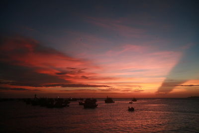 Scenic view of sea against orange sky