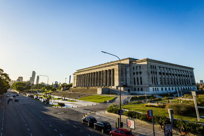 View of city street against clear sky