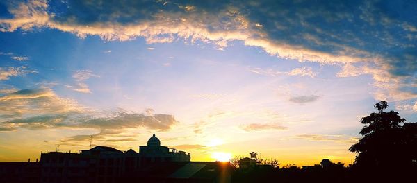 Silhouette of buildings at sunset