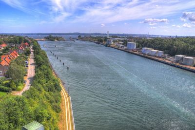 High angle view of river by city against sky