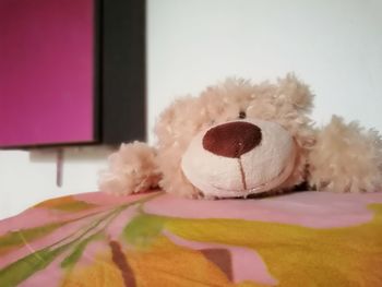Close-up of stuffed toy on bed at home