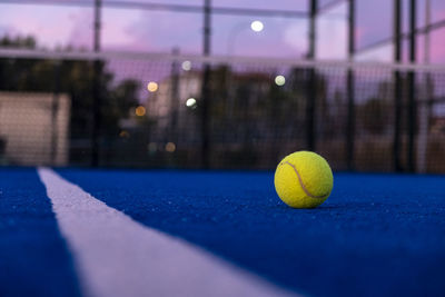 Close-up of tennis ball on field