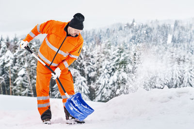 Man standing on snow covered mountain