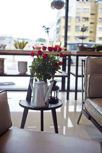 Flower vase on table in restaurant