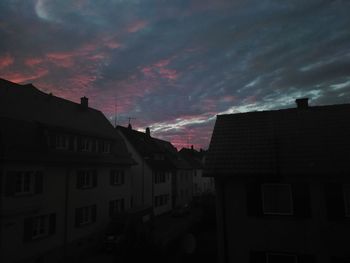 Low angle view of buildings against sky during sunset