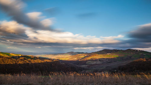Scenic view of landscape against sky during sunset