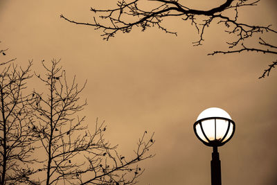 Low angle view of street light against sky