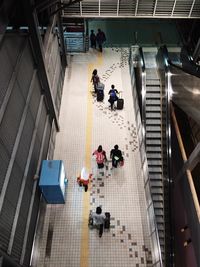 High angle view of people walking in building