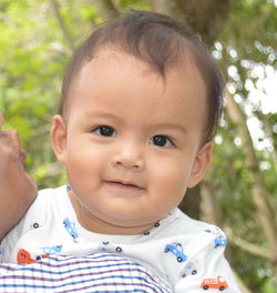 Close-up portrait of cute smiling baby boy