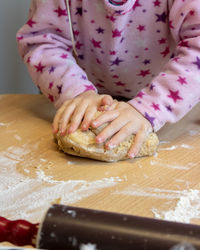 Midsection of woman preparing food at home