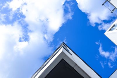 Low angle view of building against cloudy sky