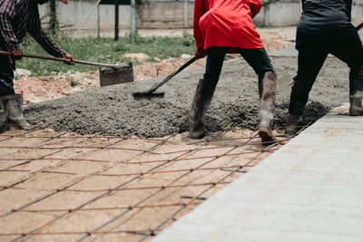Low section of people walking on footpath