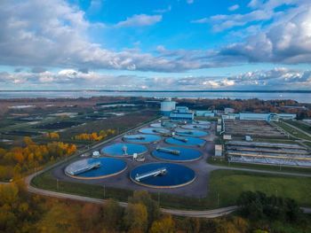 High angle view of road by city against sky