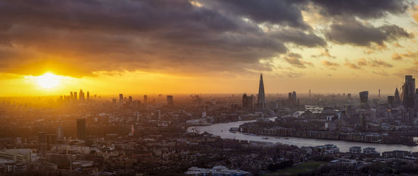 Aerial view of city during sunset